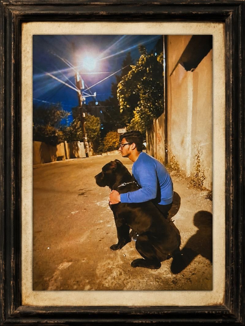 A young Dr. Naveed with his first Cane Corso in Georgia